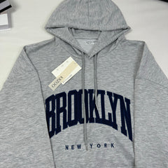 Hooded sweatshirt is loose