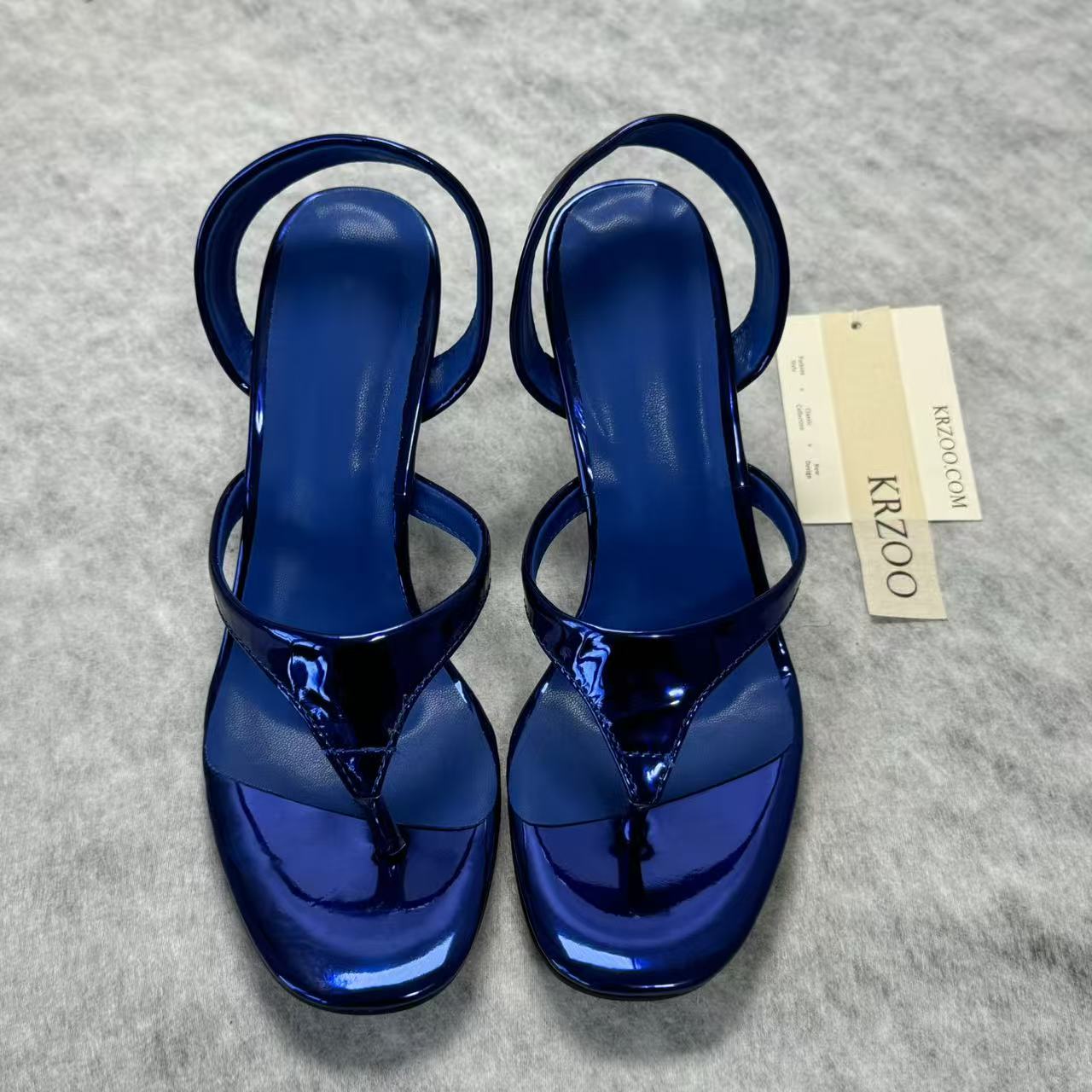 A slip-on toeless open-toe Roman-style shoe