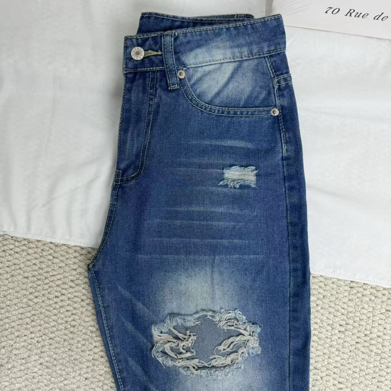 High-Waisted Ripped Jeans