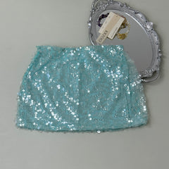 A figure-hugging midriff-baring half-length skirt