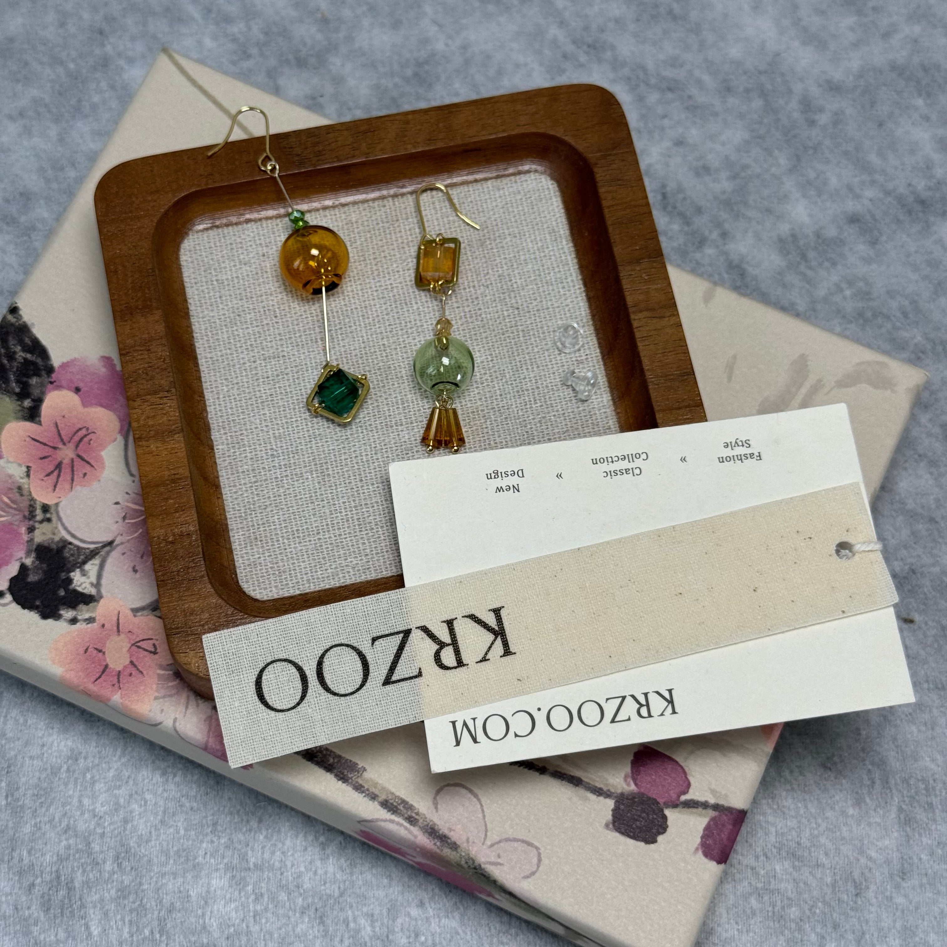 T glass ball asymmetrical long green earrings