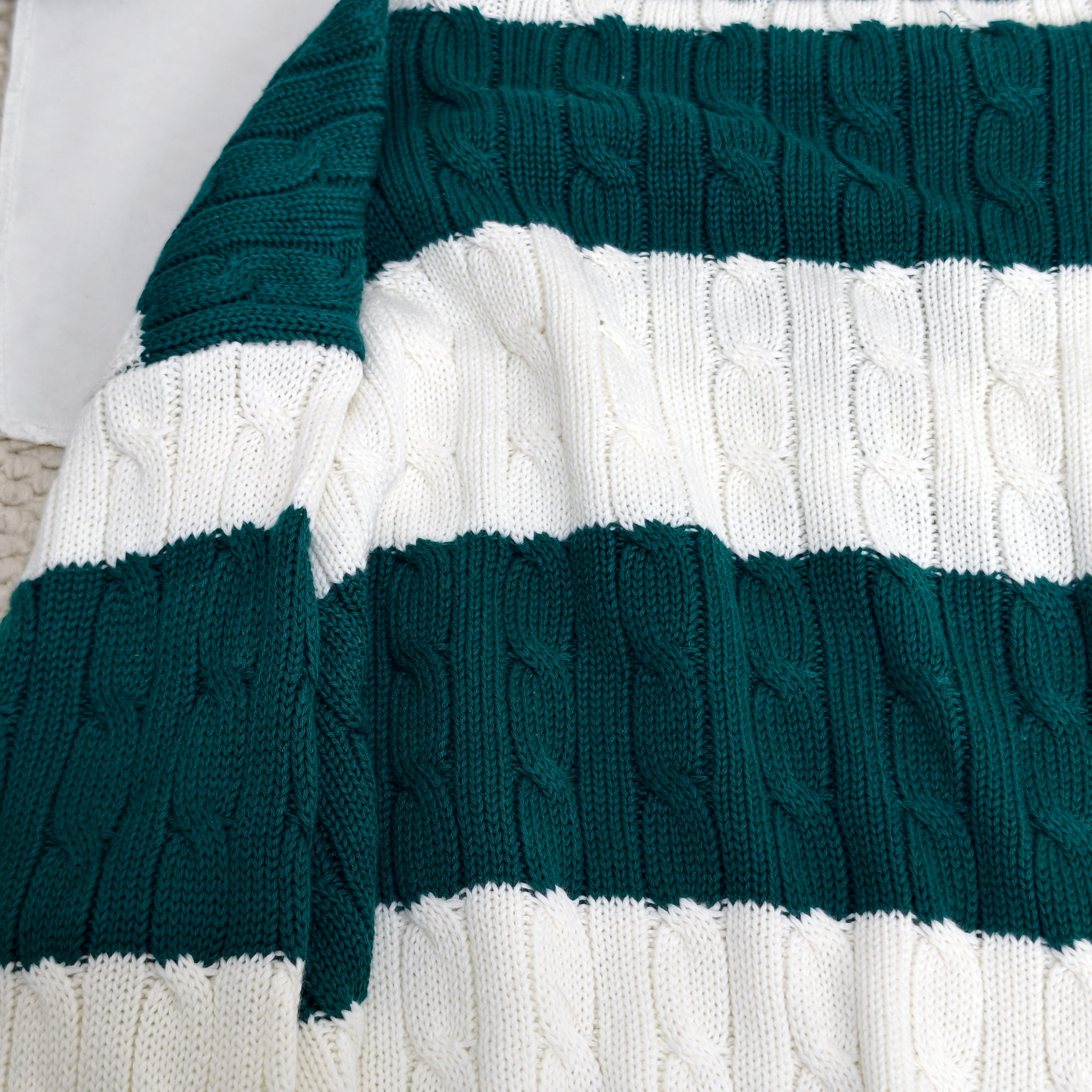 Striped twisted V-neck knitted sweater