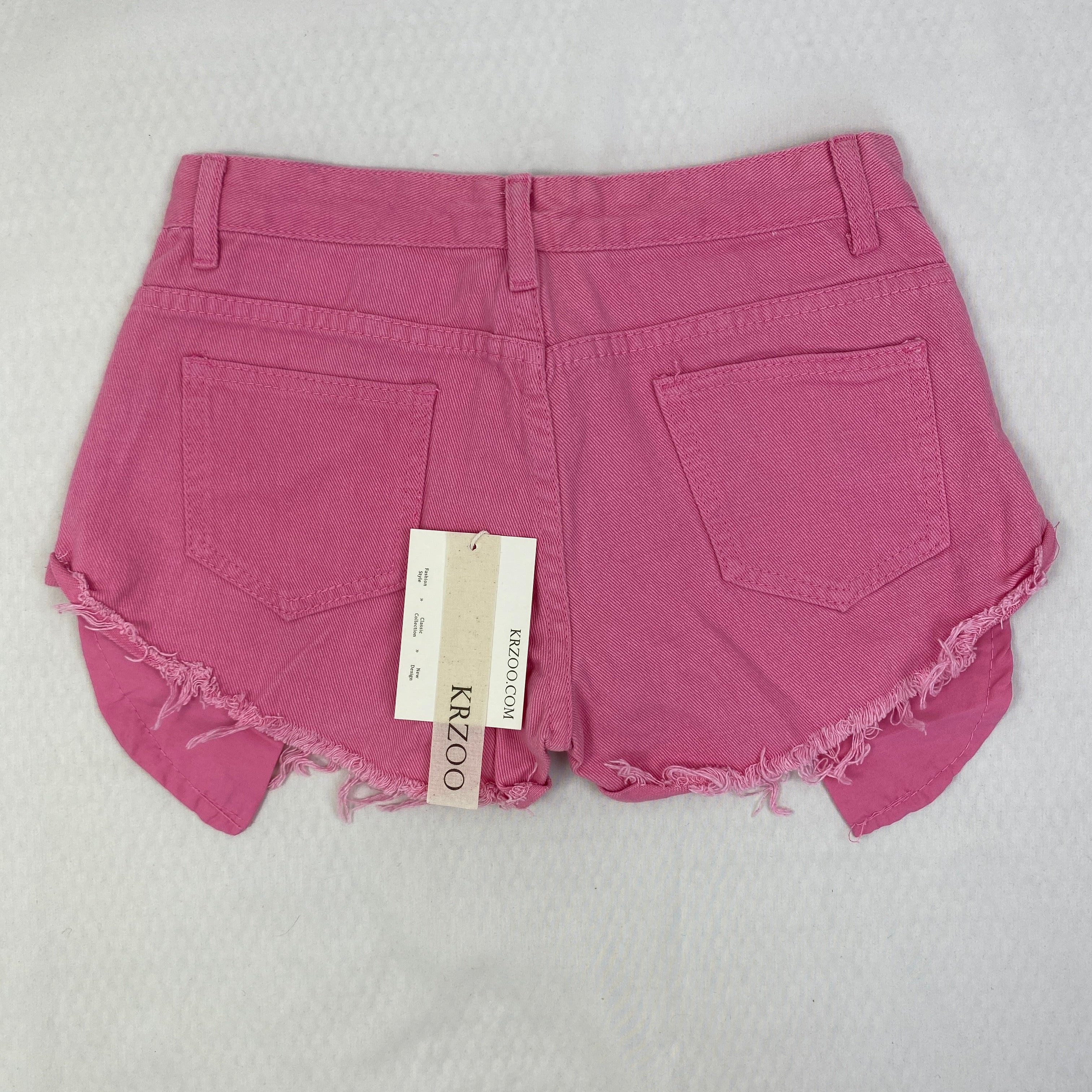 Jeans shorts with rolled hems and exposed pockets