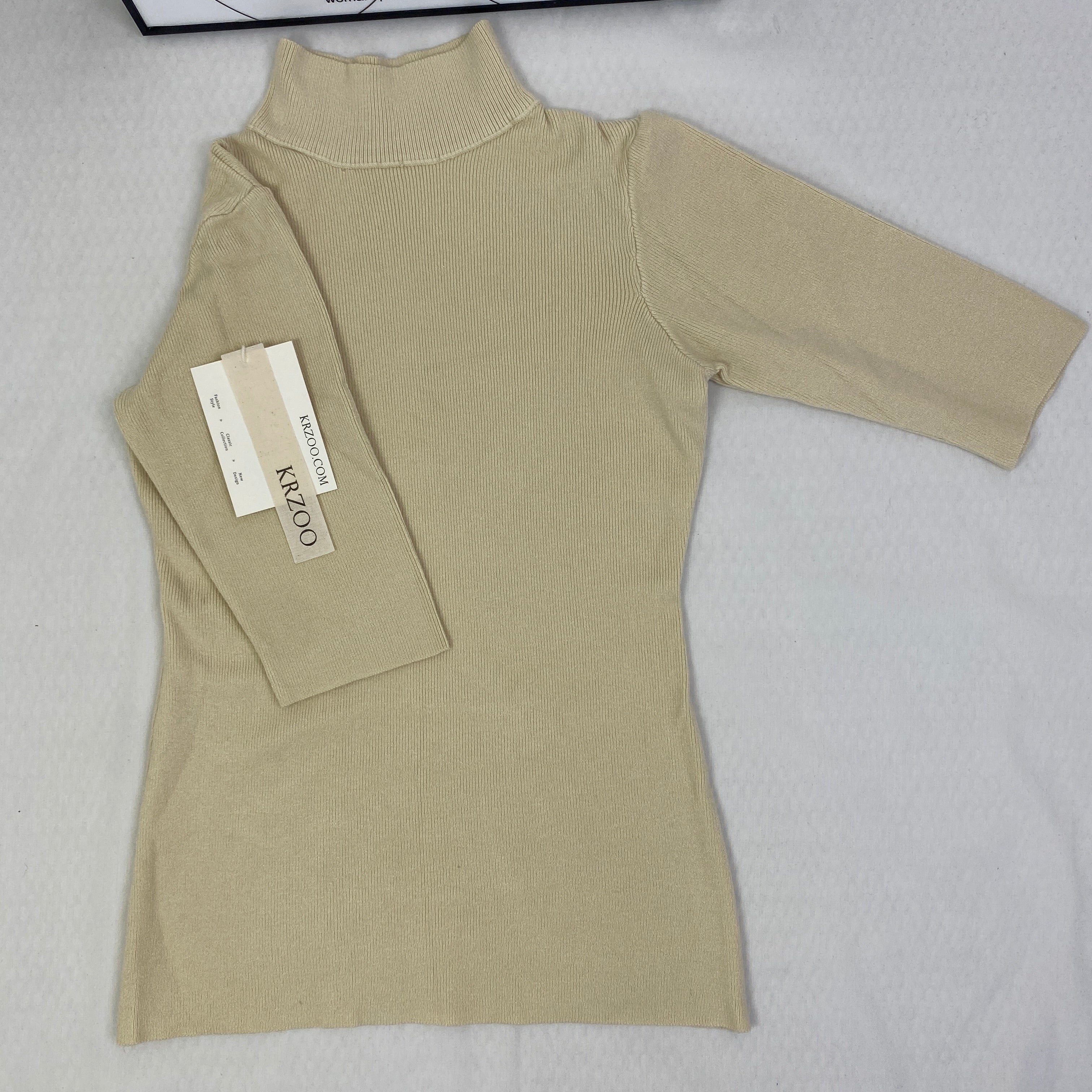 A fitted mid-neck knitted sweater
