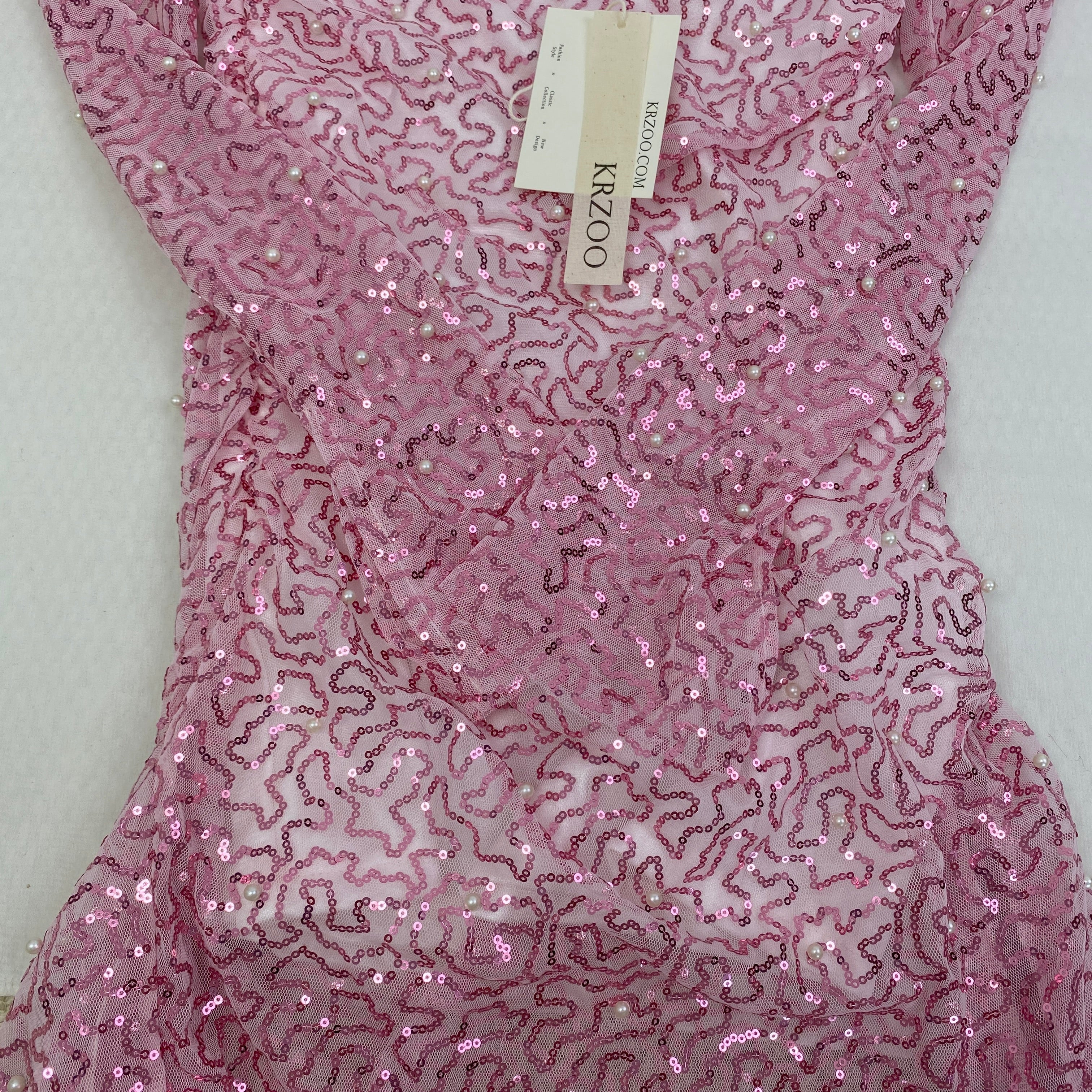A slimming, soft pink, figure-hugging dress