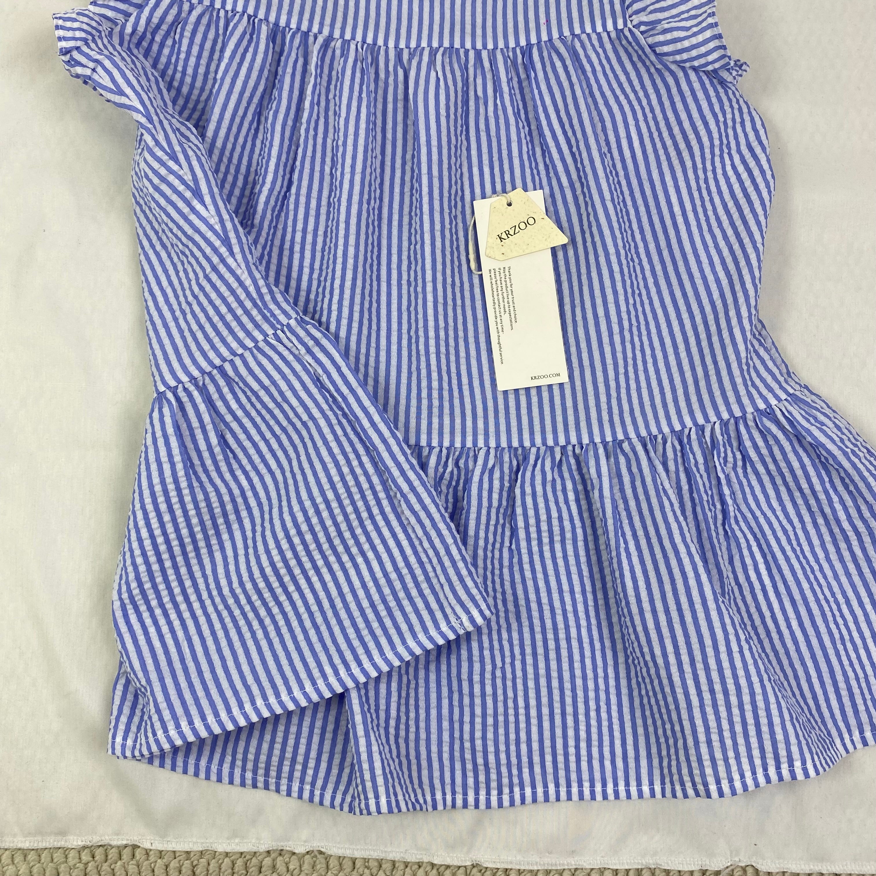 Blue and white thin striped sleeveless shirt