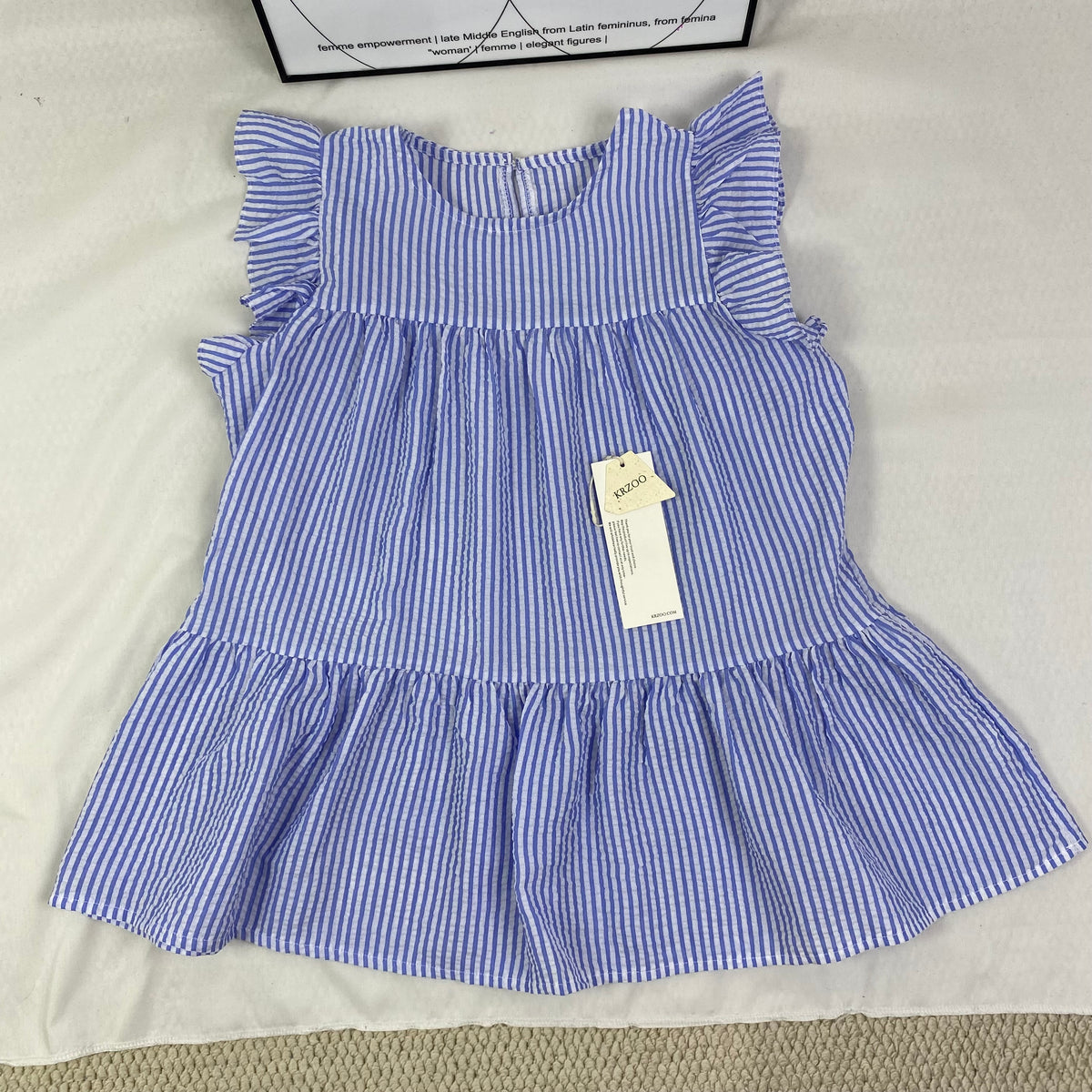 Blue and white thin striped sleeveless shirt