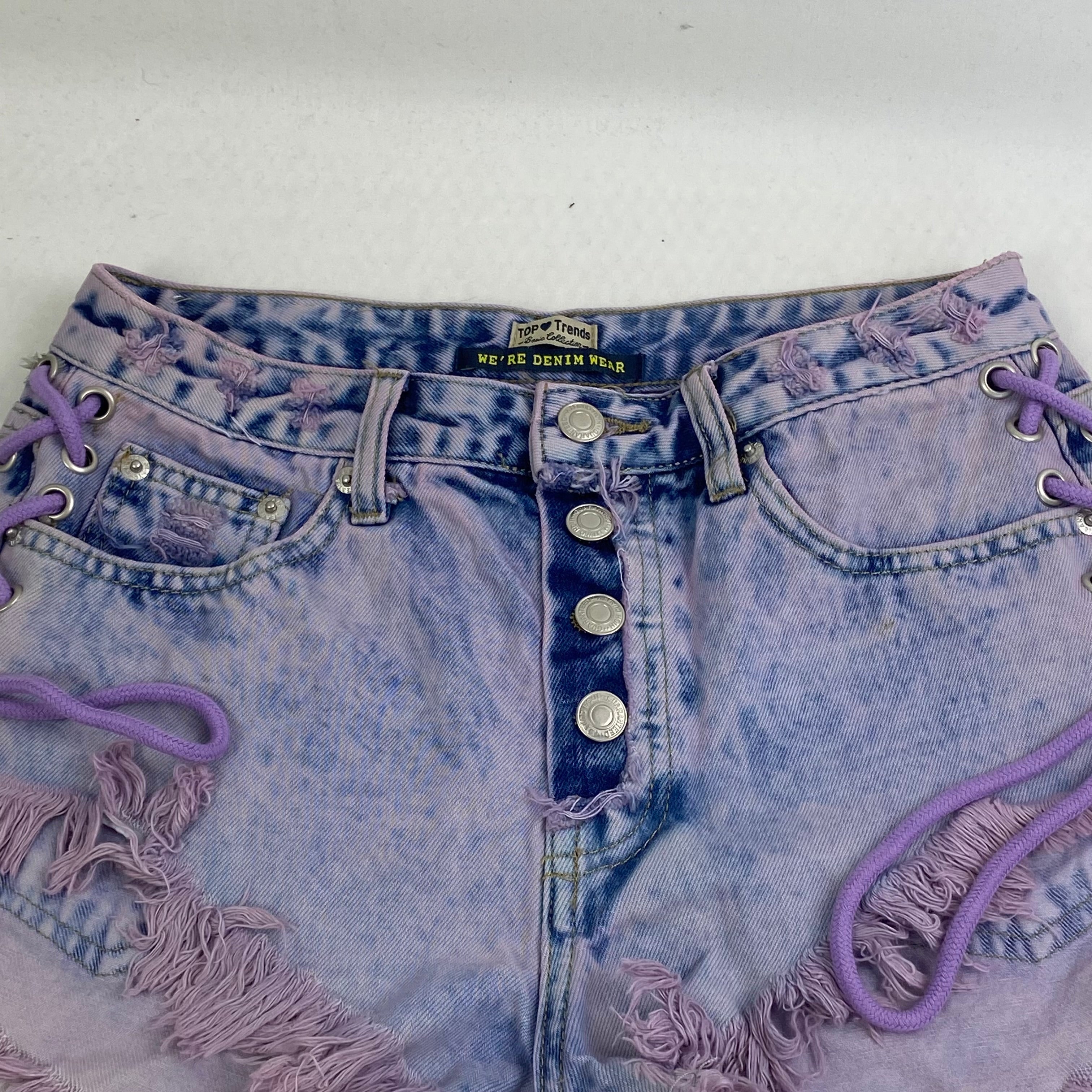 Purple strapped buttoned fringed shorts