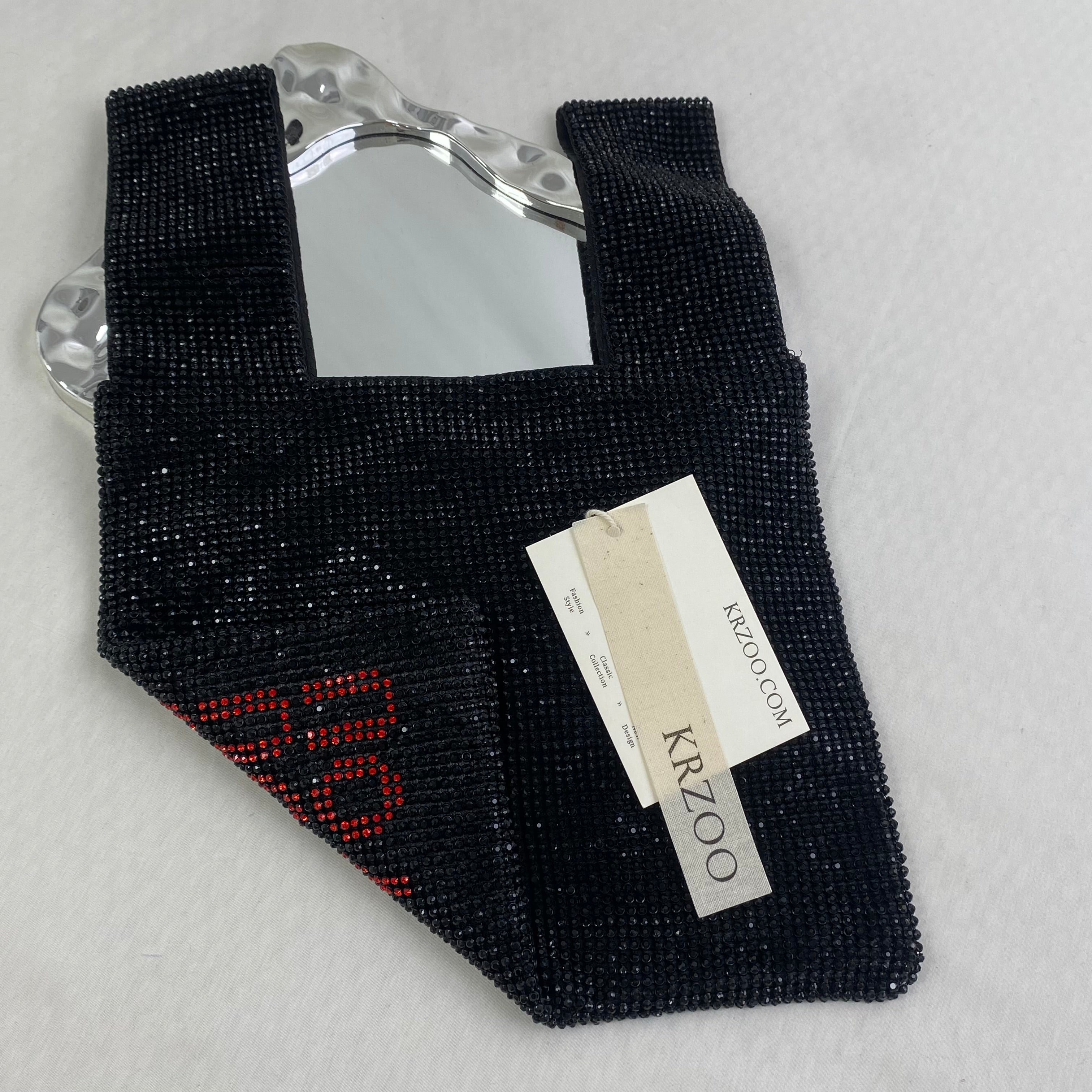 Diamond-studded heart-shaped handbag