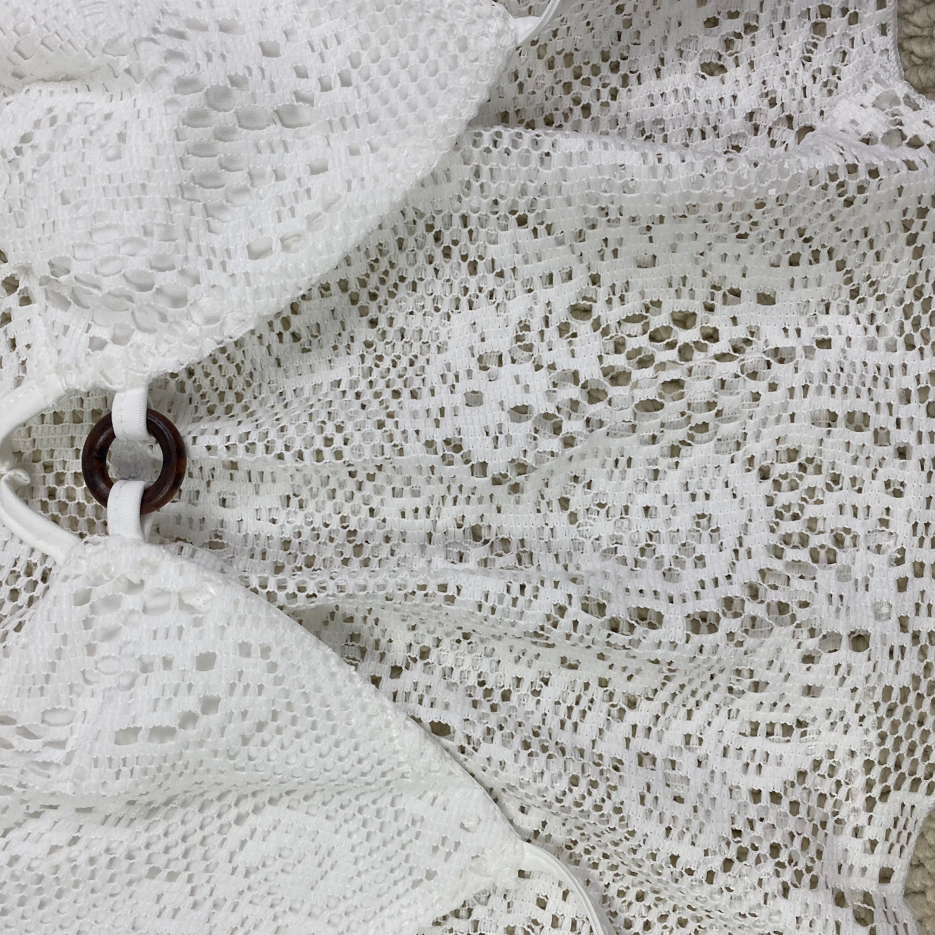 Ruffled lace circular necked top with hollow design