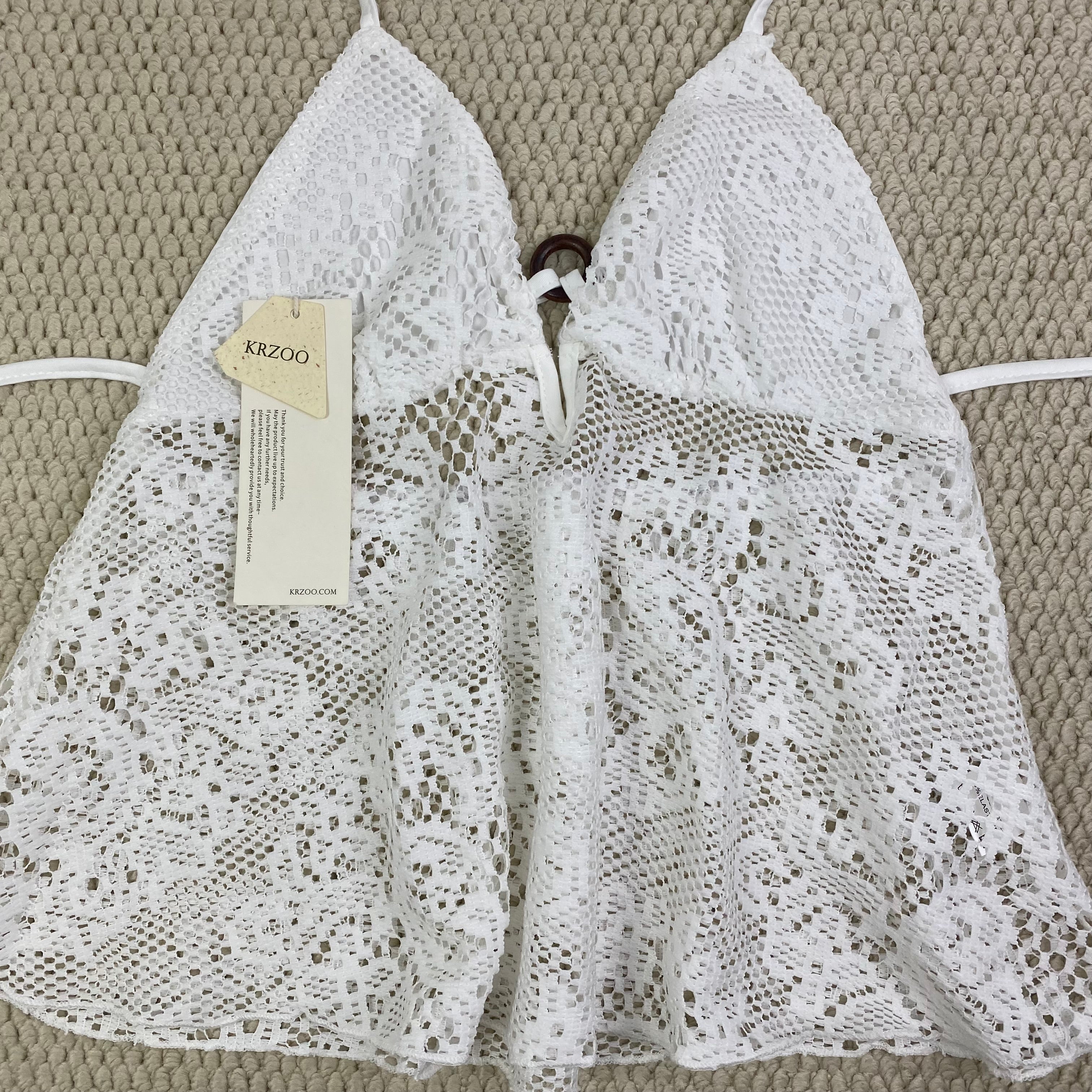 Ruffled lace circular necked top with hollow design