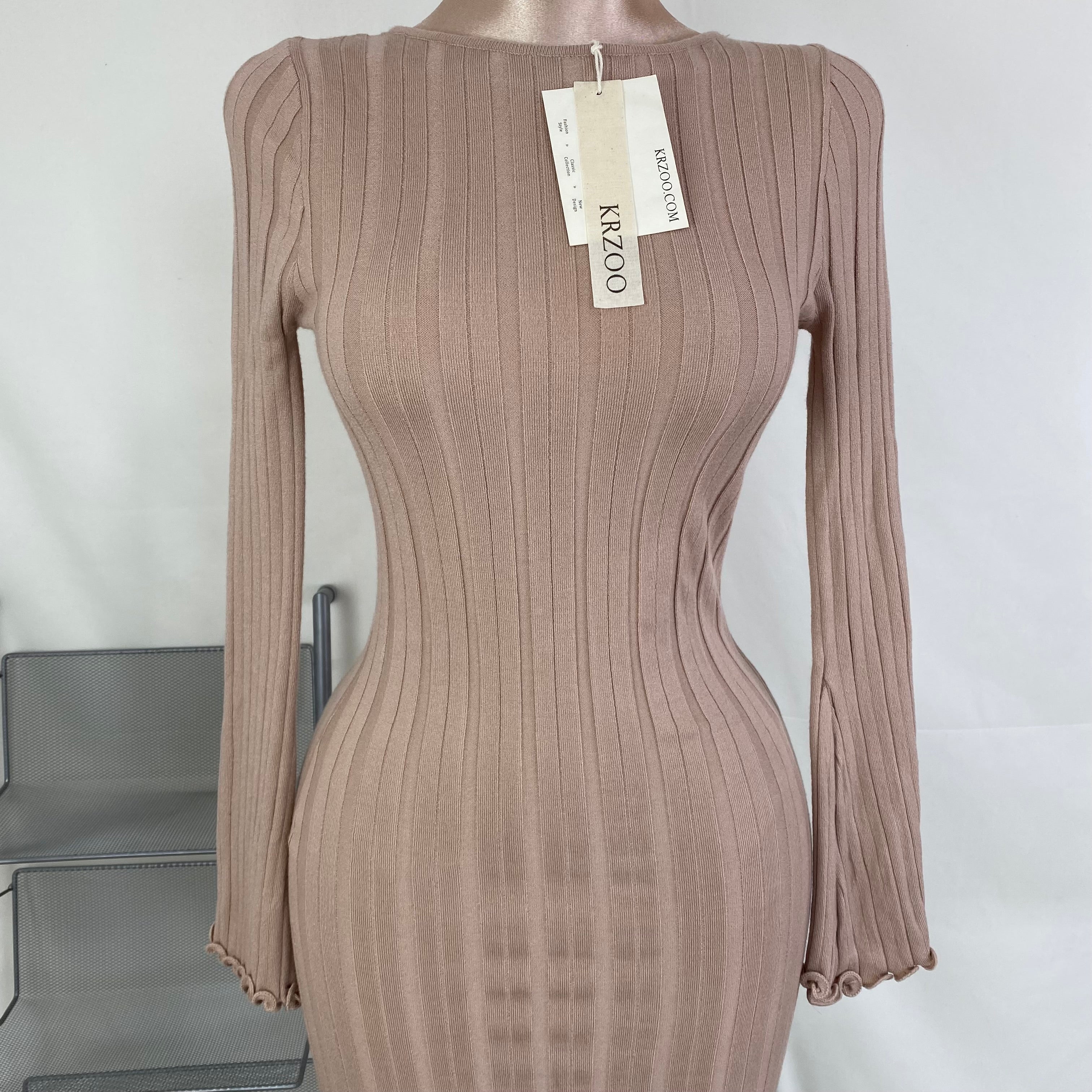 A fitted, ruffled edge knitted long dress