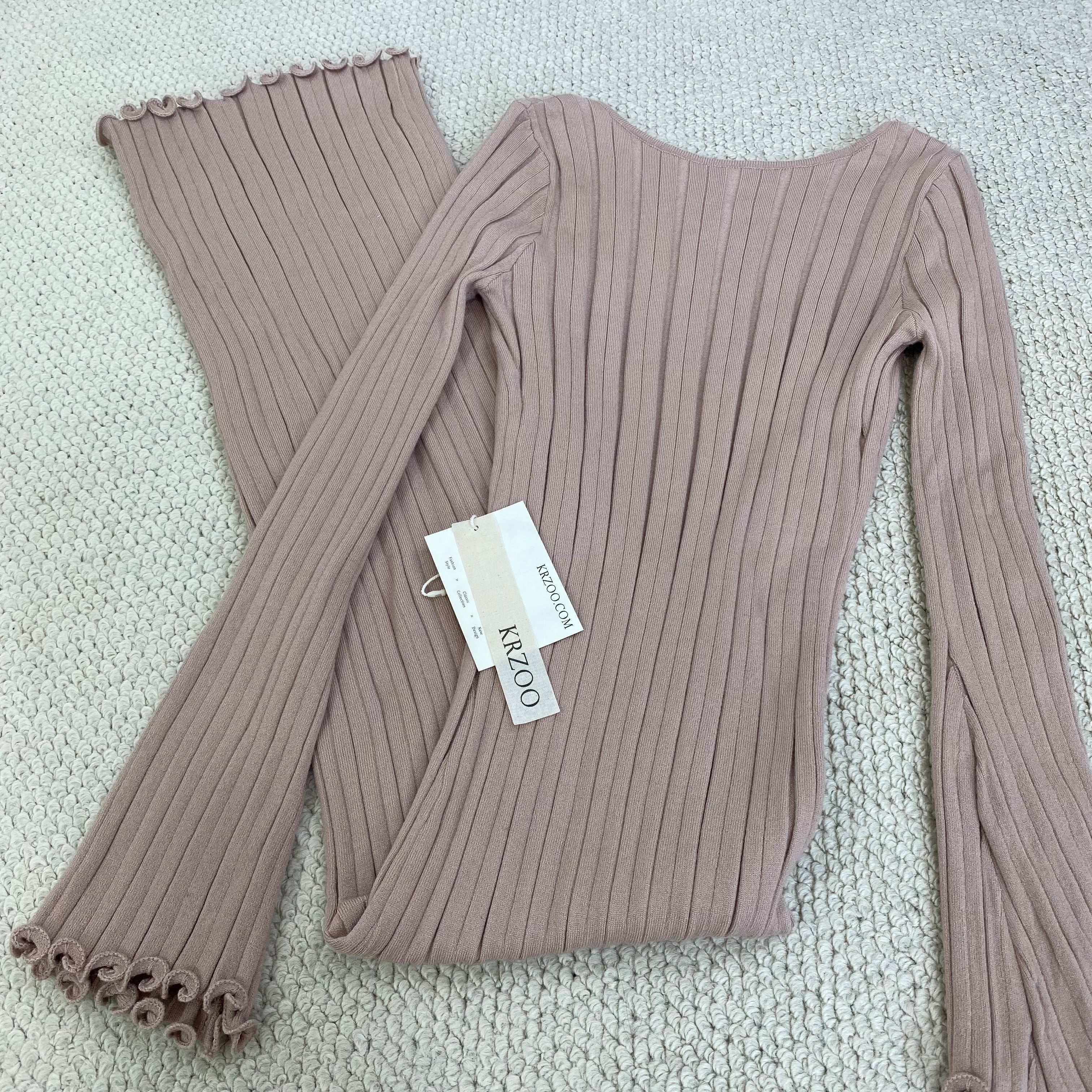 A fitted, ruffled edge knitted long dress