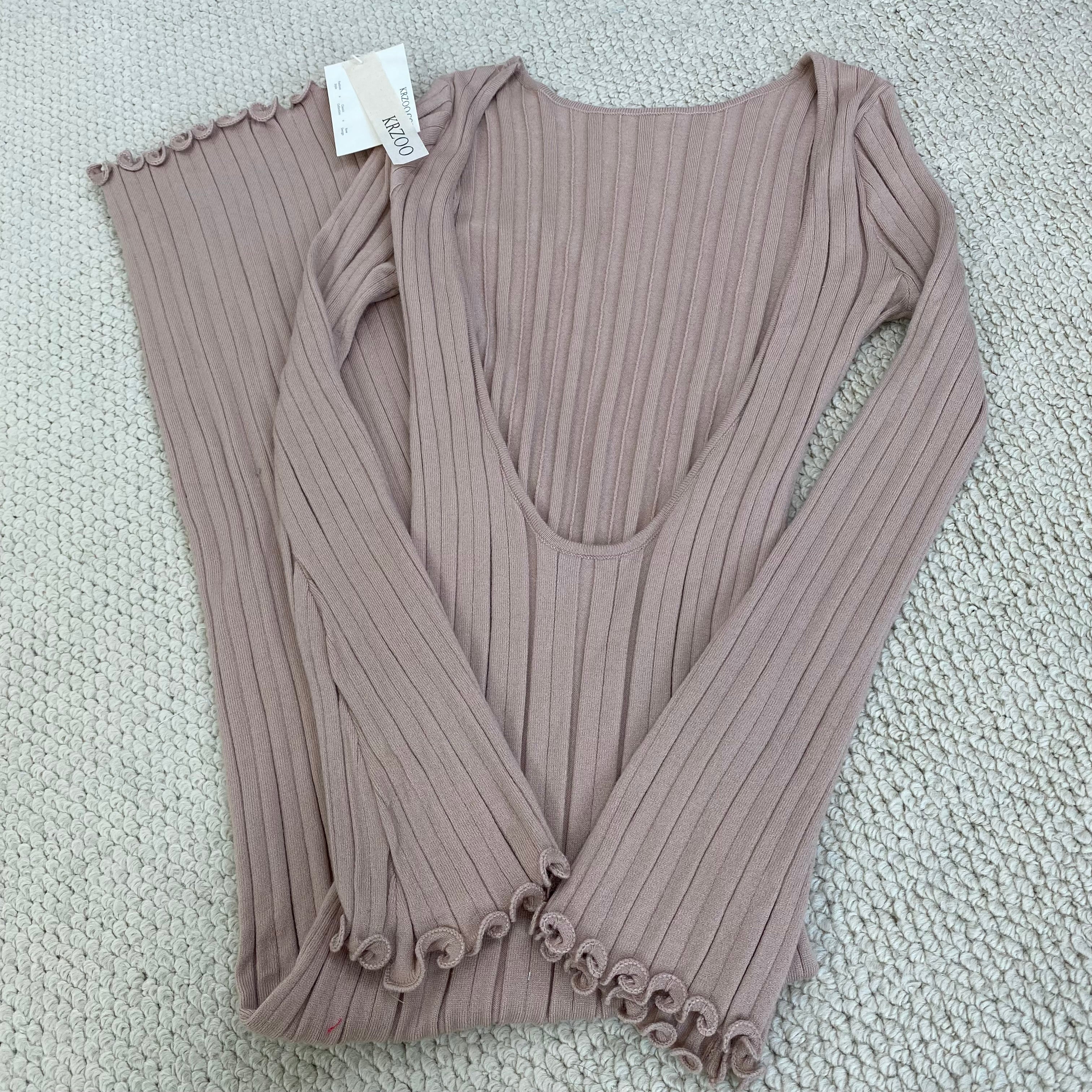 A fitted, ruffled edge knitted long dress