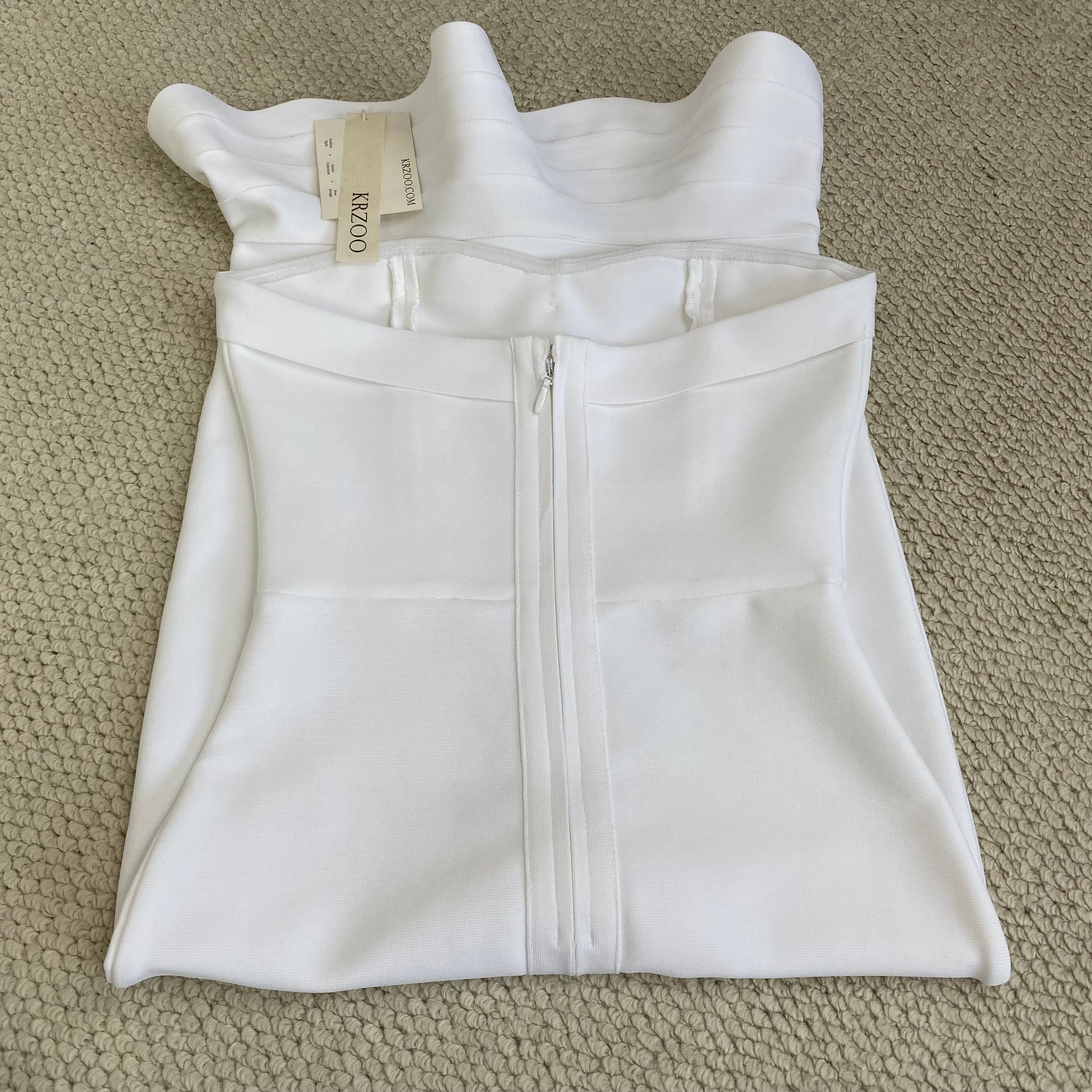 Knitted frilled hemmed plunging dress