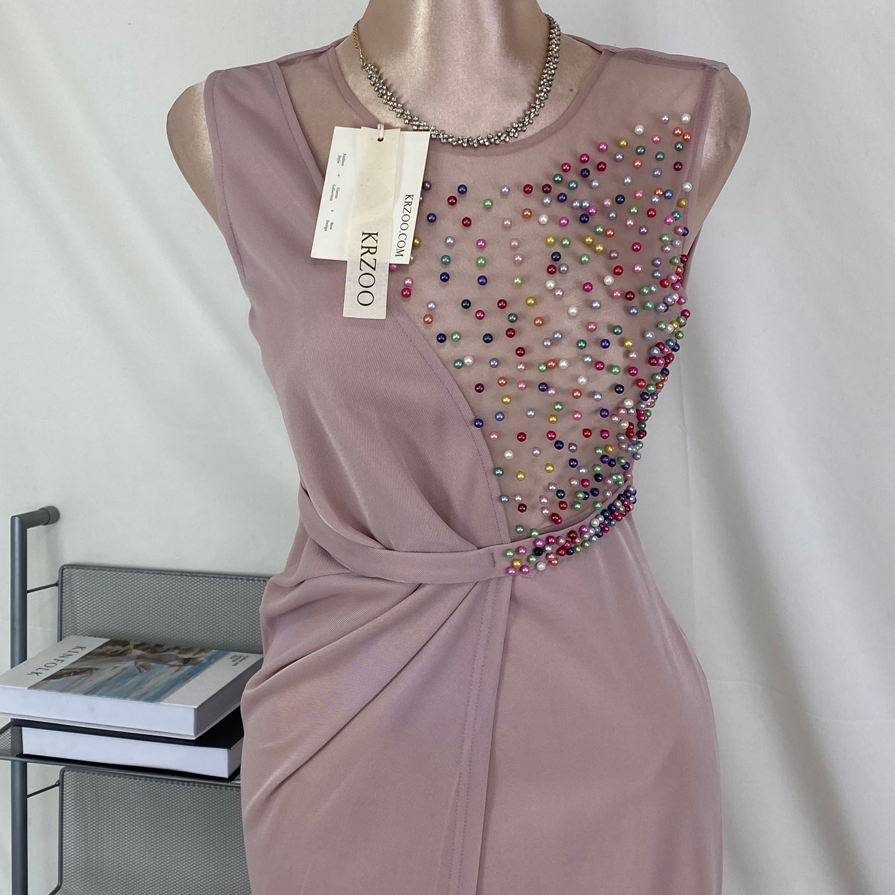 A halter-style and trailing evening dress