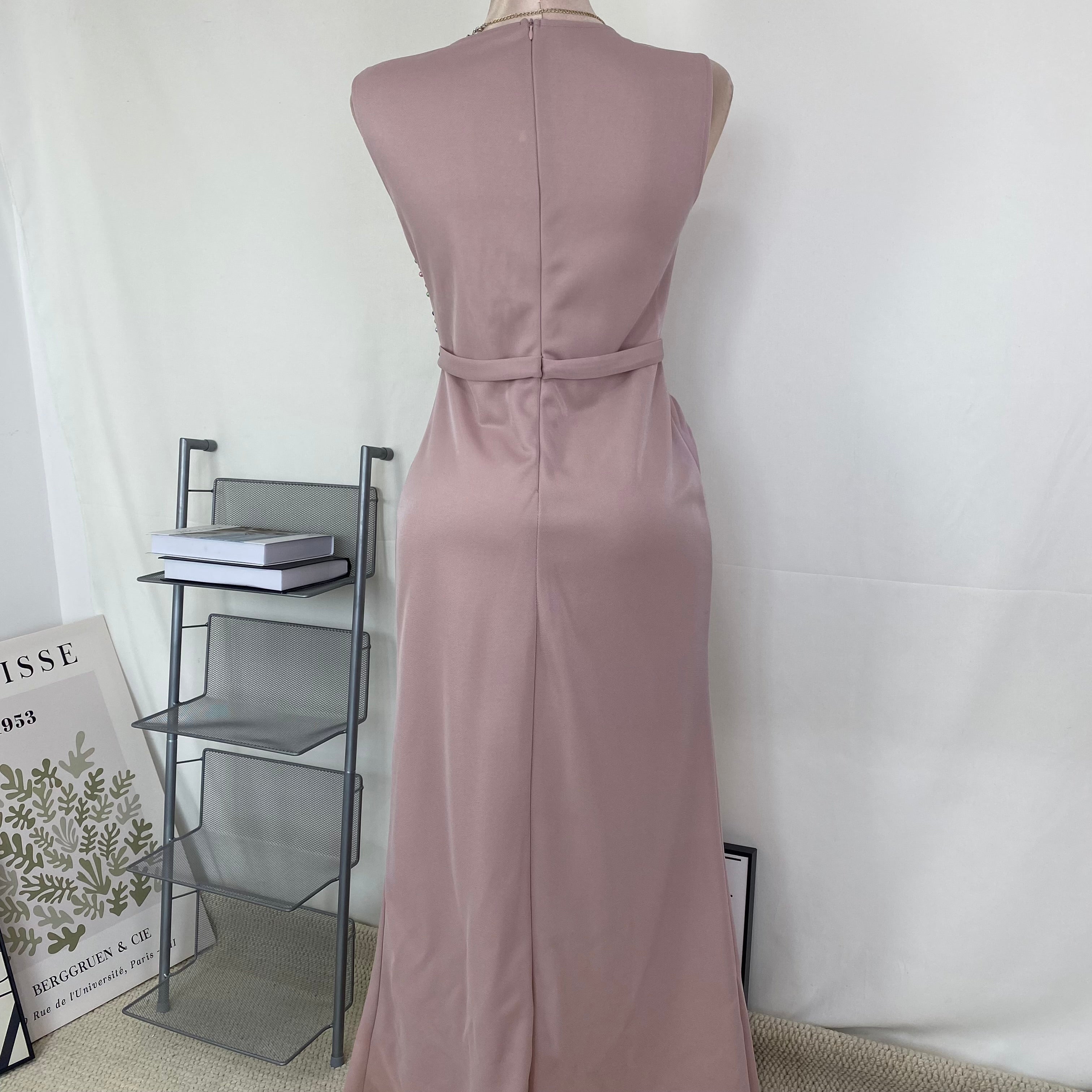 A halter-style and trailing evening dress