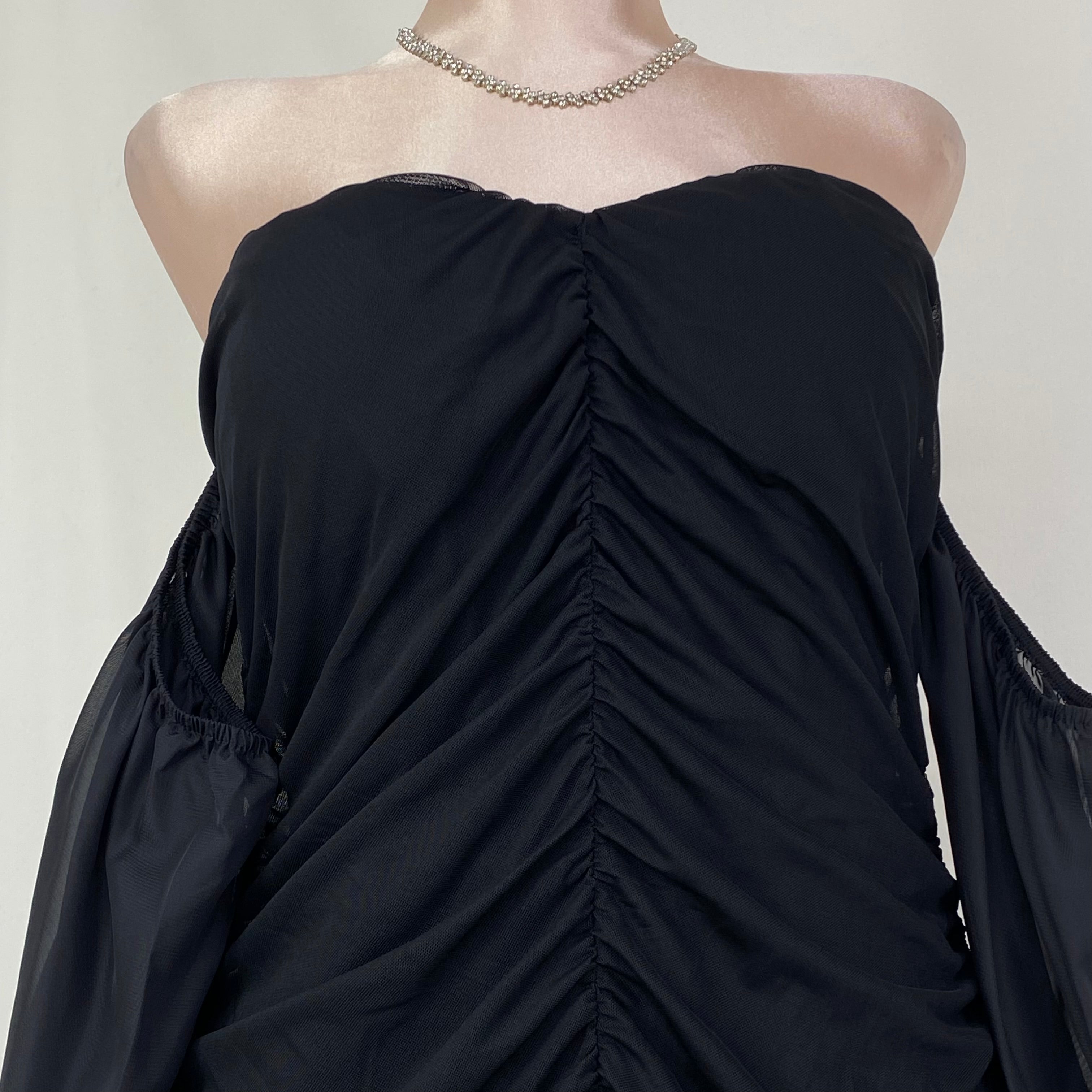 A tight-fitting short dress with a plunging neckline
