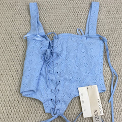 Zippered bodice with fishbone belt top garment