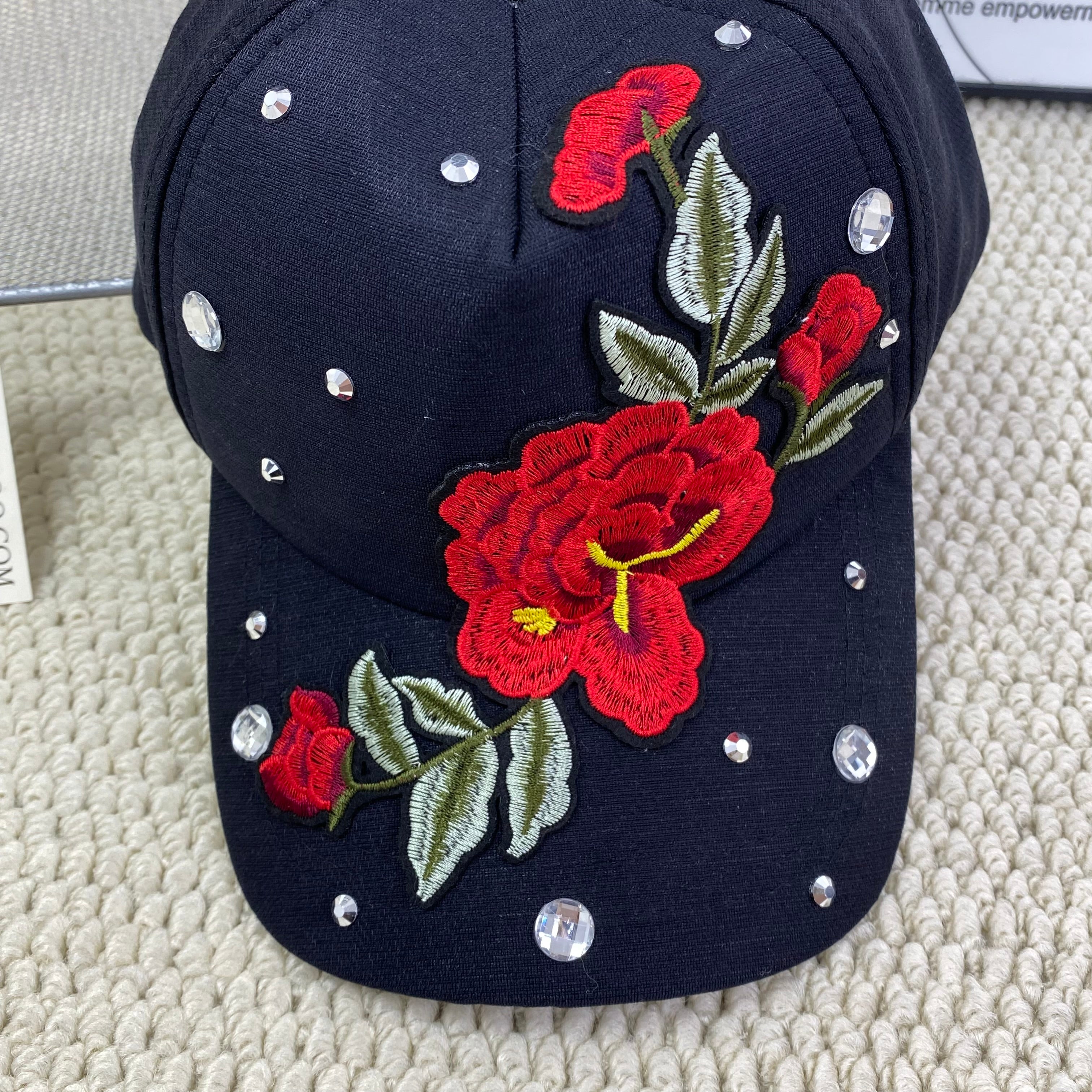 Rose-colored hat with diamond trim baseball cap