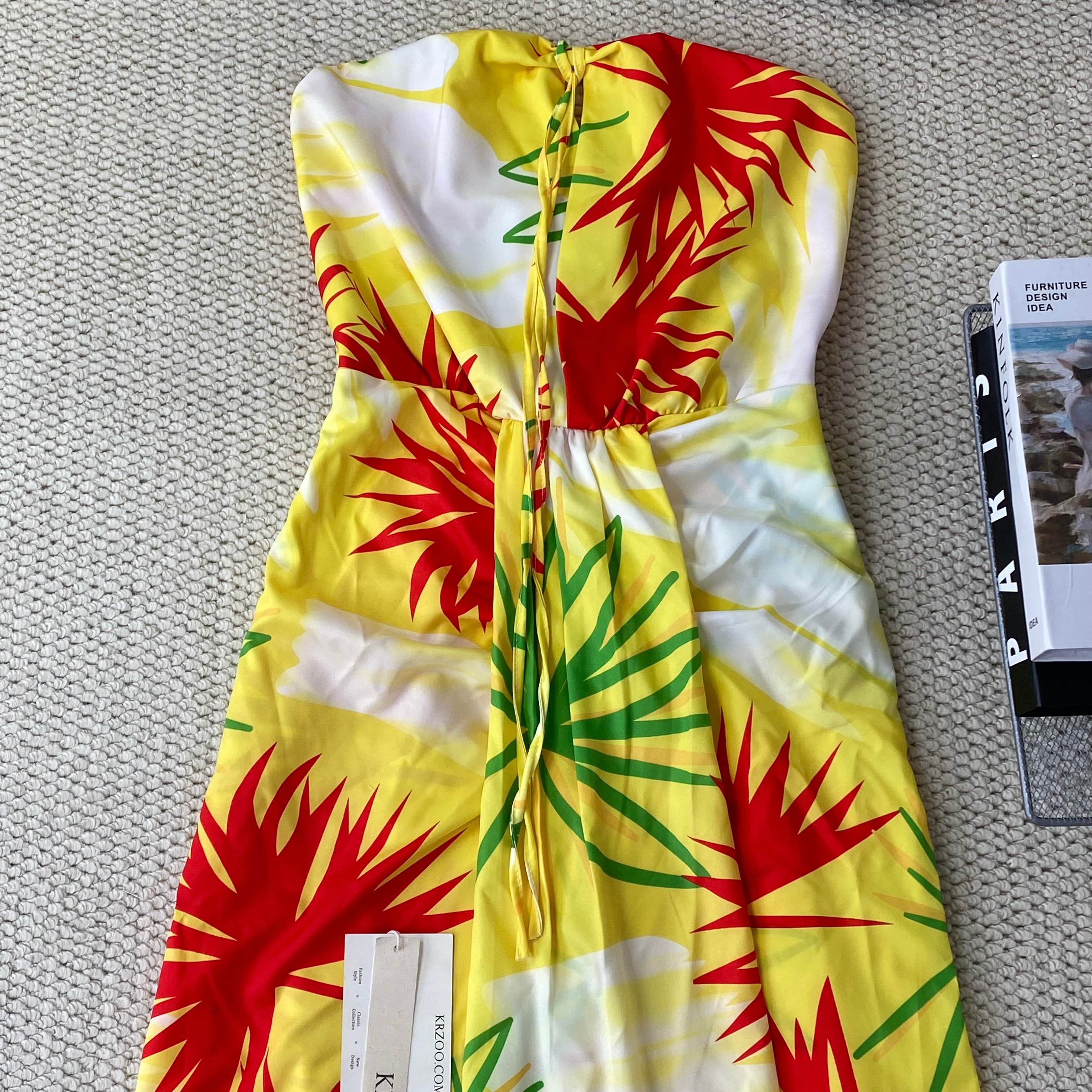 A strapless floral-printed halter dress
