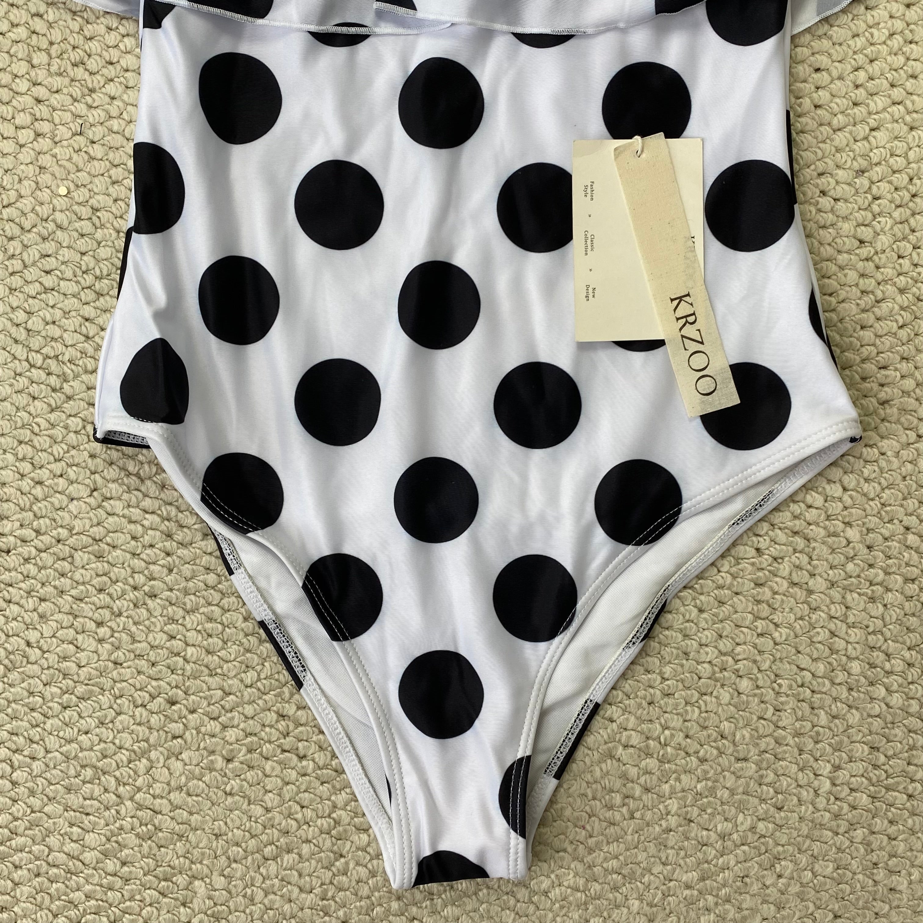 Off-the-shoulder polka-dot ruffled swimsuit