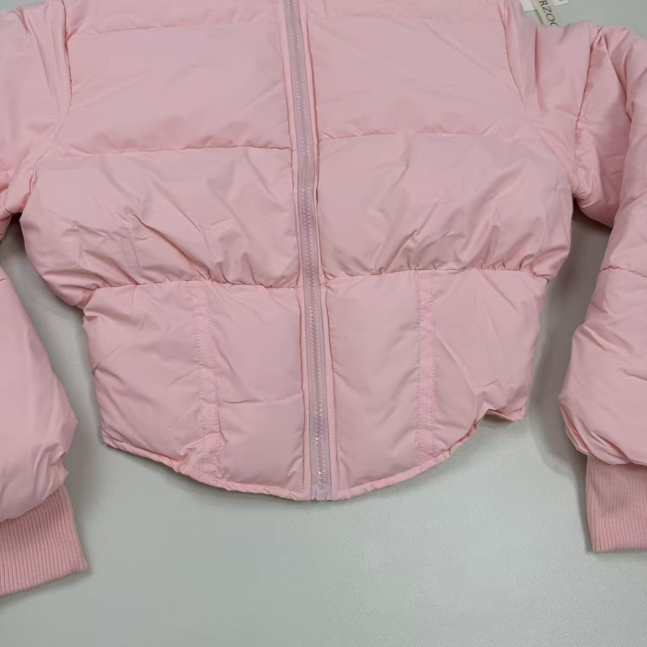 A slim-fitting short coat with a stand-up collar