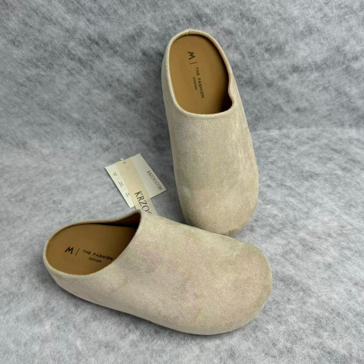 One foot wearing a thick-soled baghdad-style shoe