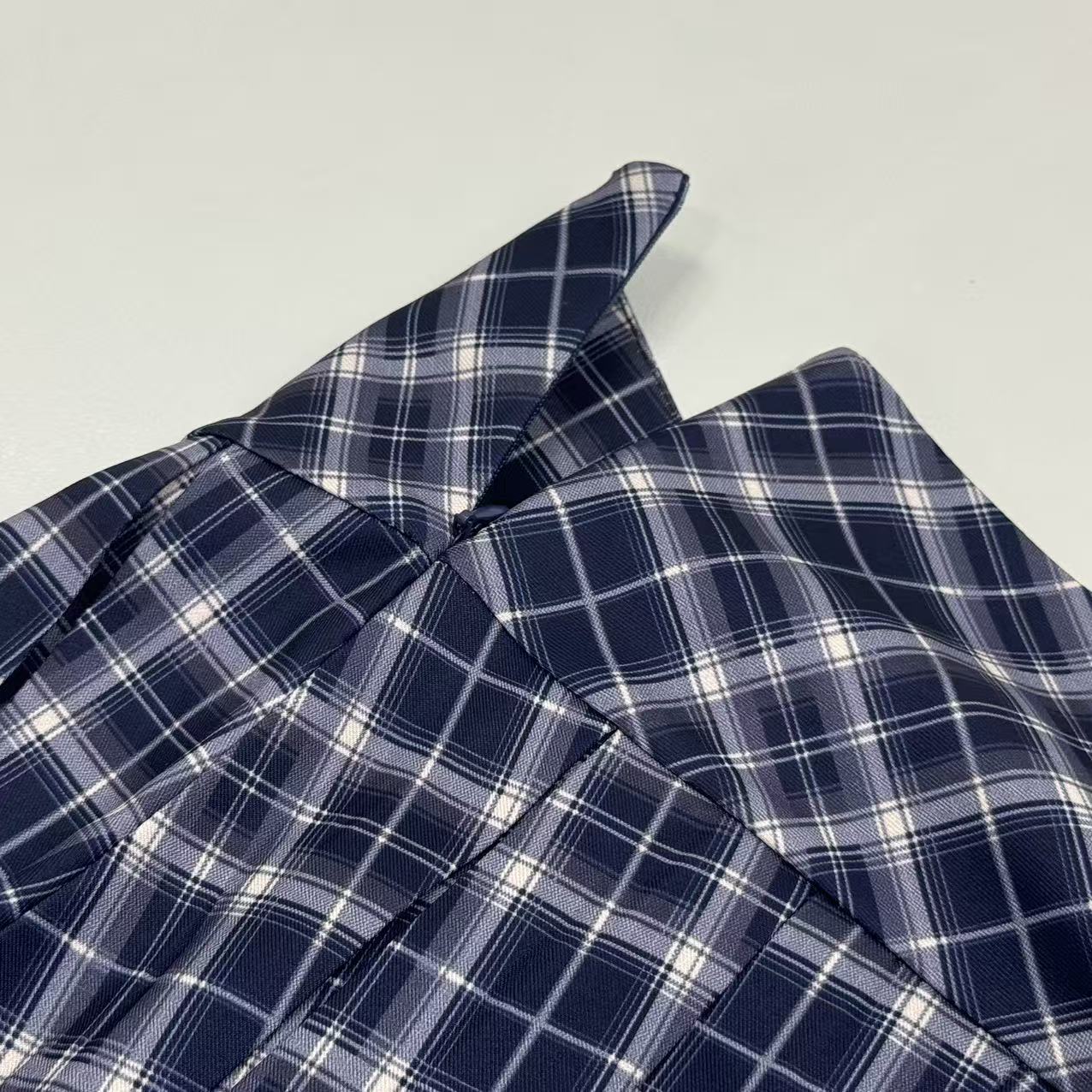 Plaid pleated A-line midi skirt