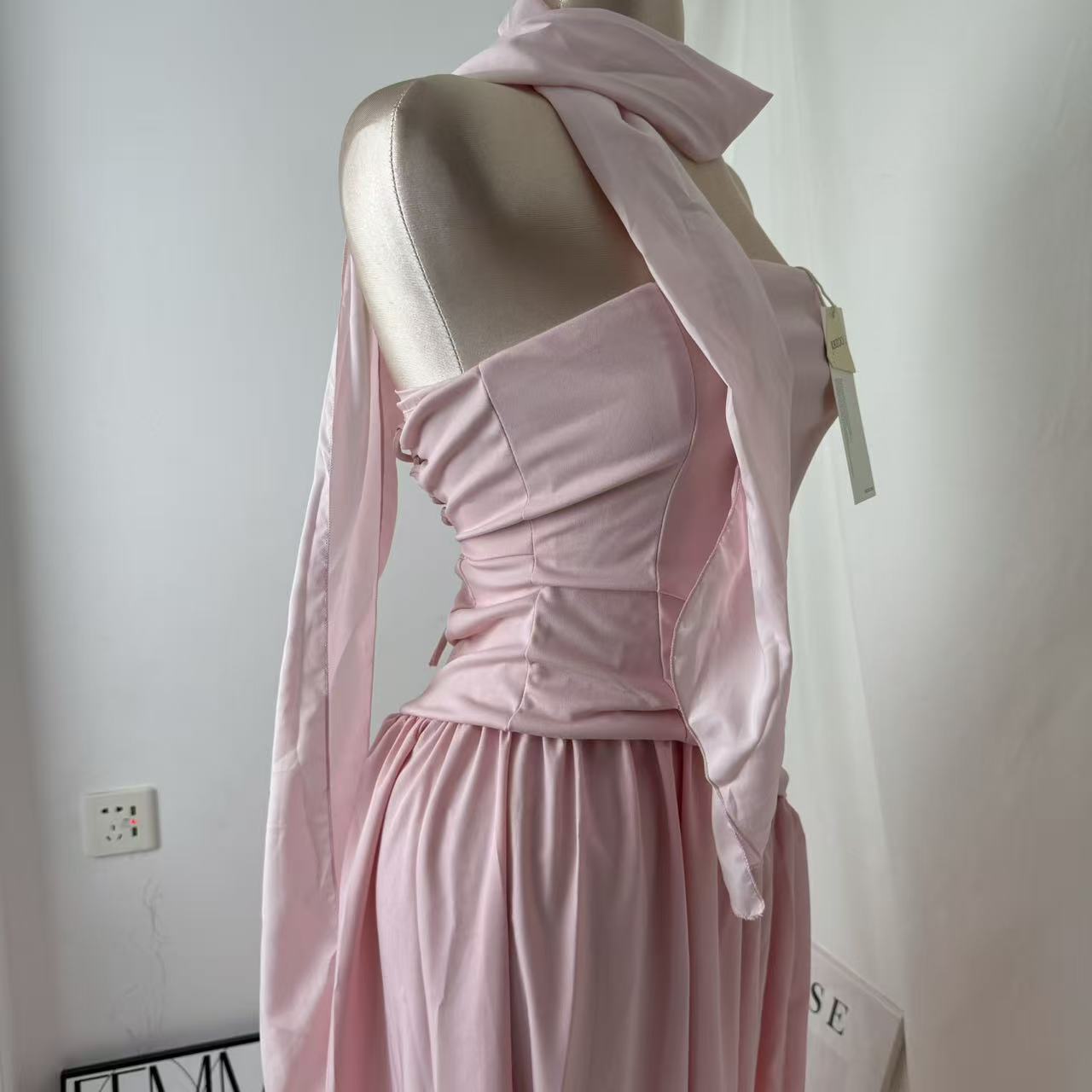 Pink-belted strapless dress