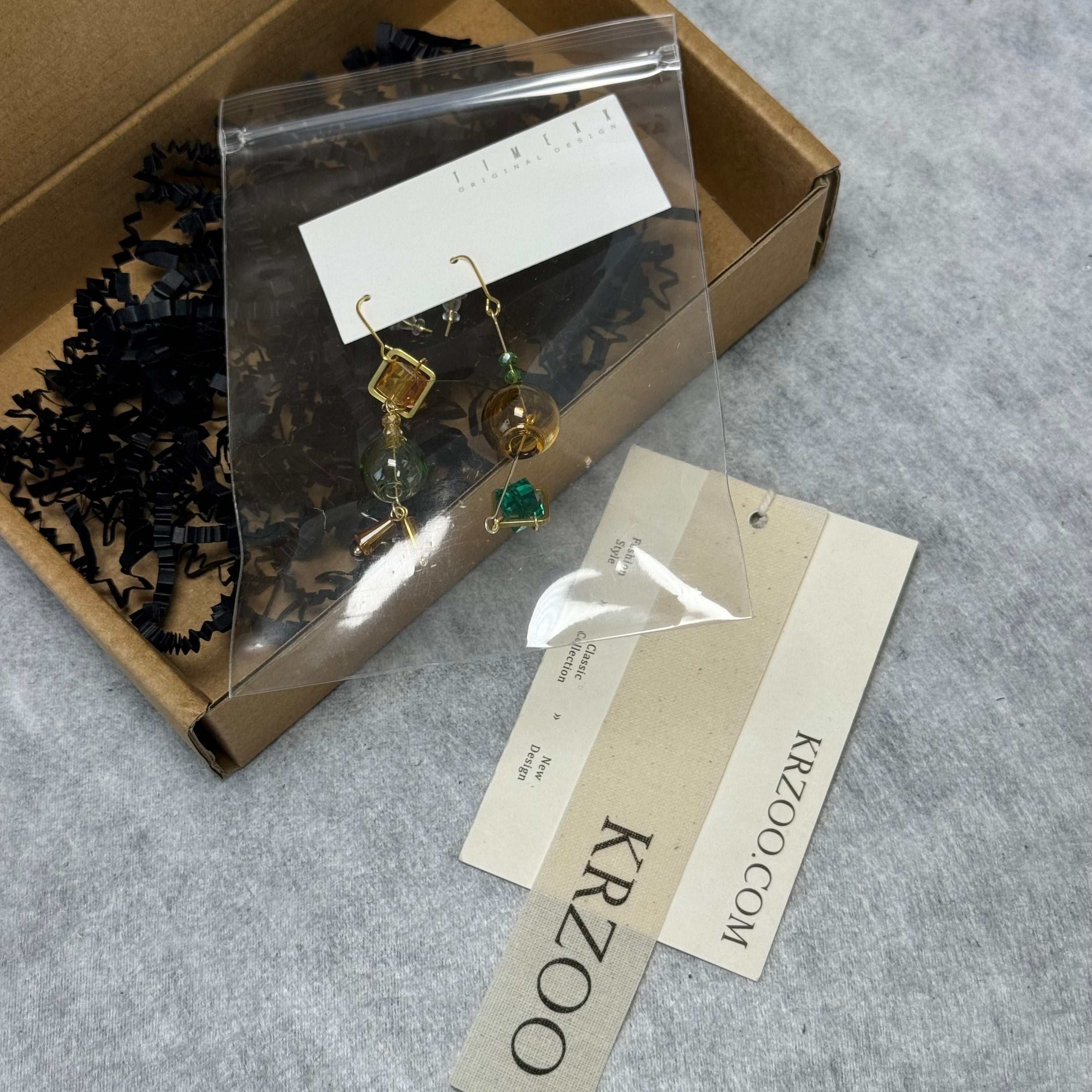 T glass ball asymmetrical long green earrings