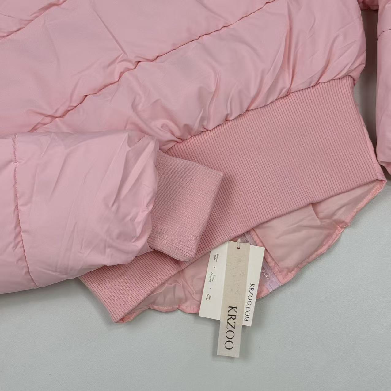A slim-fitting short coat with a stand-up collar