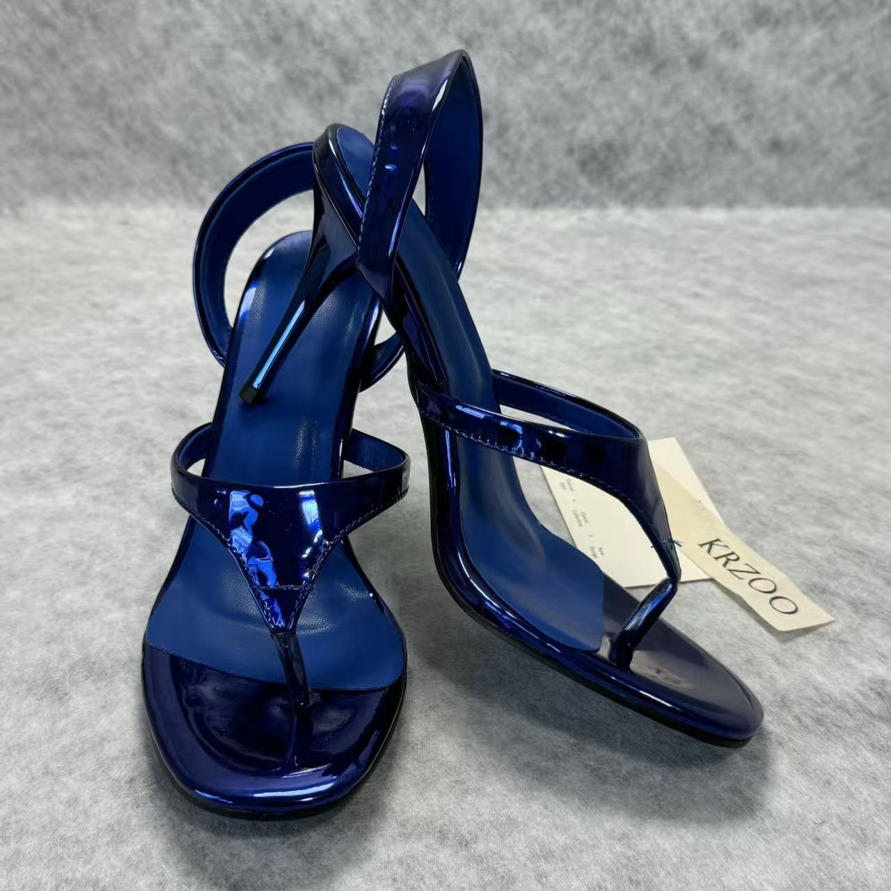 A slip-on toeless open-toe Roman-style shoe