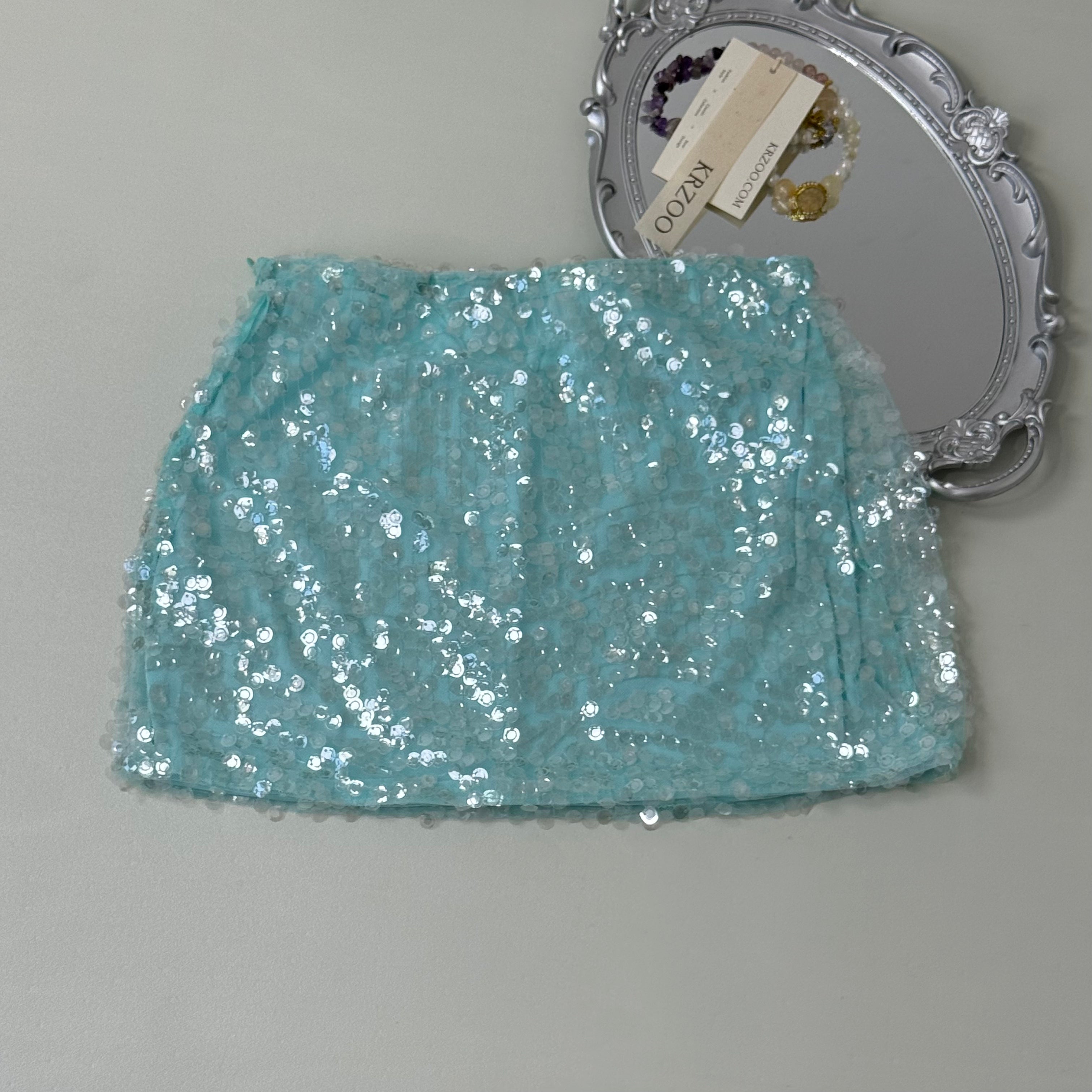 A figure-hugging midriff-baring half-length skirt