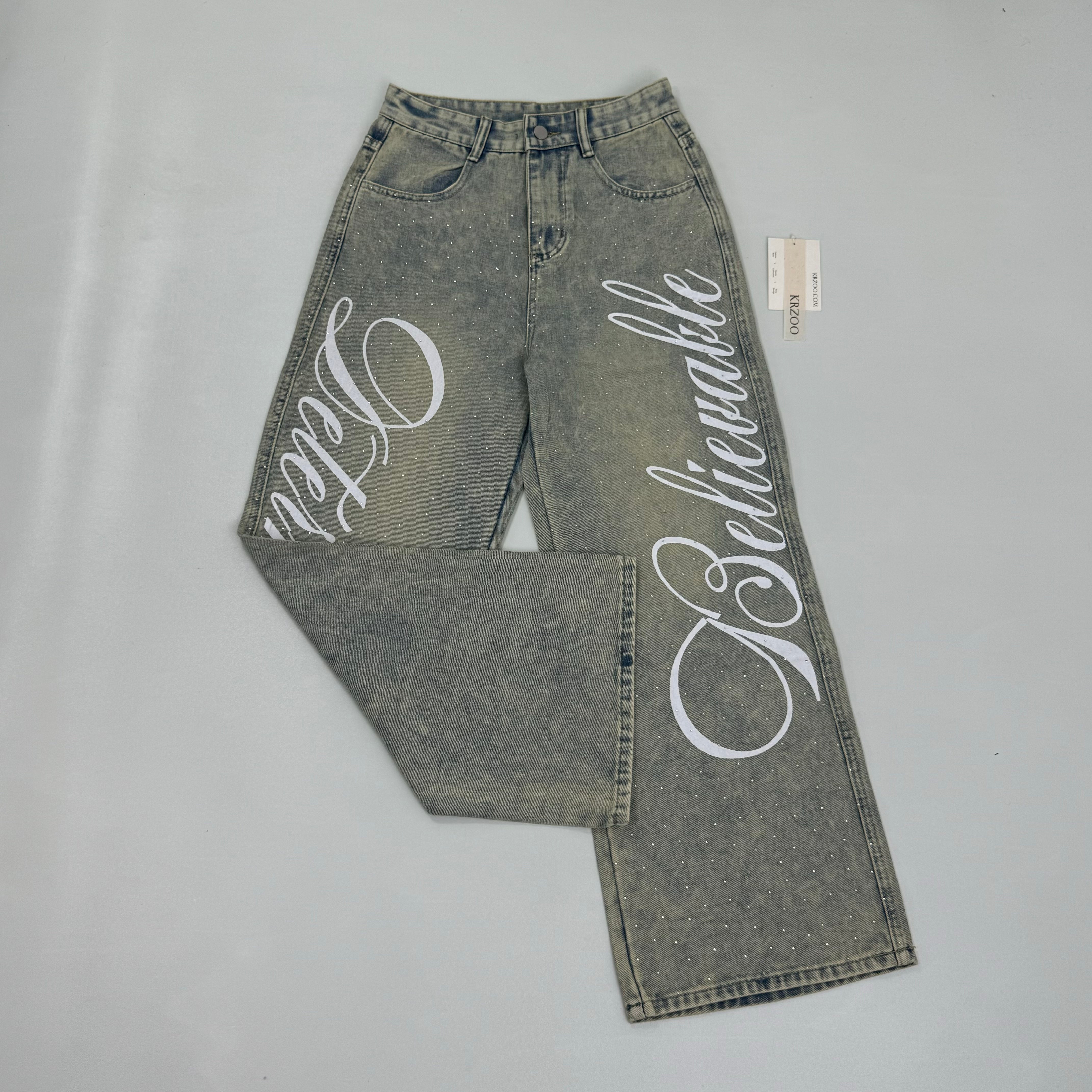 Washed letter-printed sequined denim pants