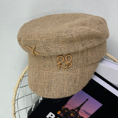 Woven straw cap with a flat top