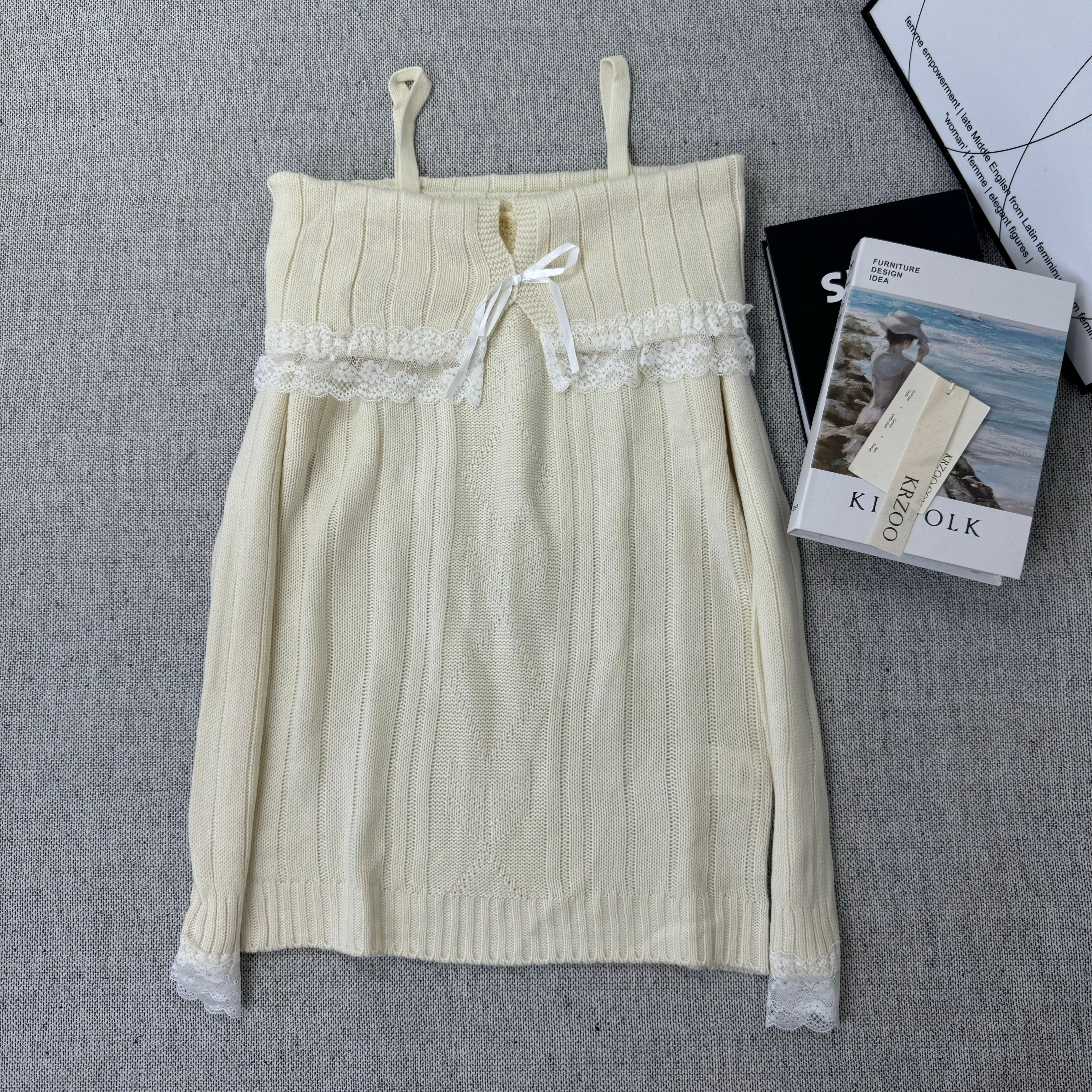 Lace trimmed one-shoulder sweater