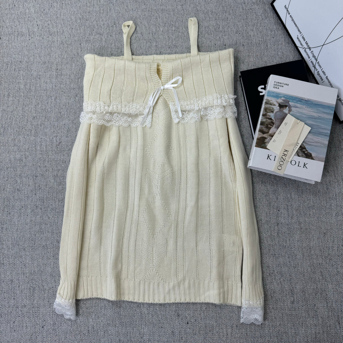 Lace trimmed one-shoulder sweater