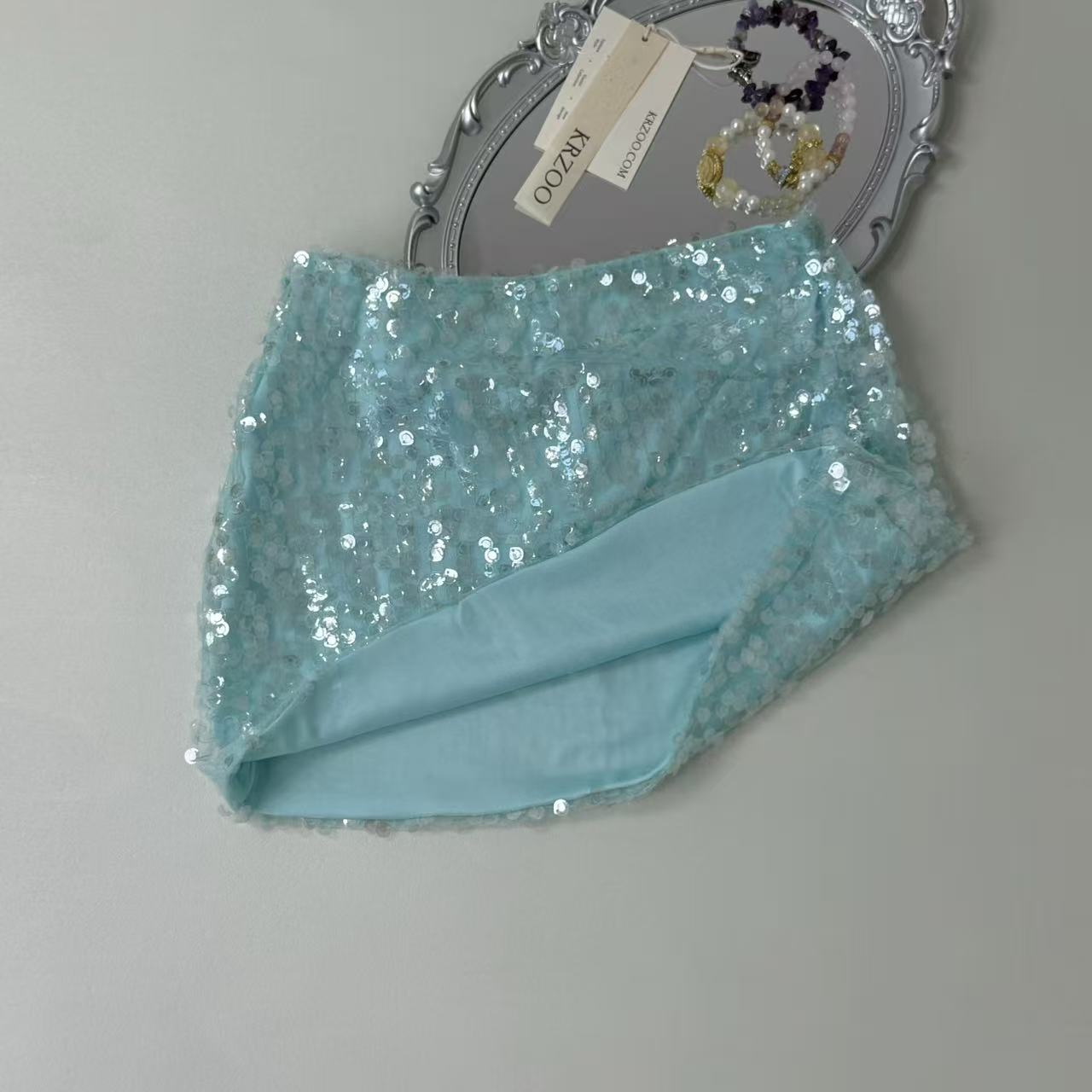 A figure-hugging midriff-baring half-length skirt