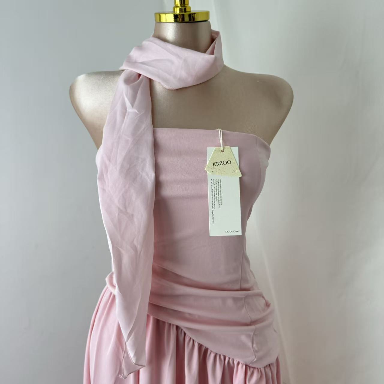 Pink-belted strapless dress